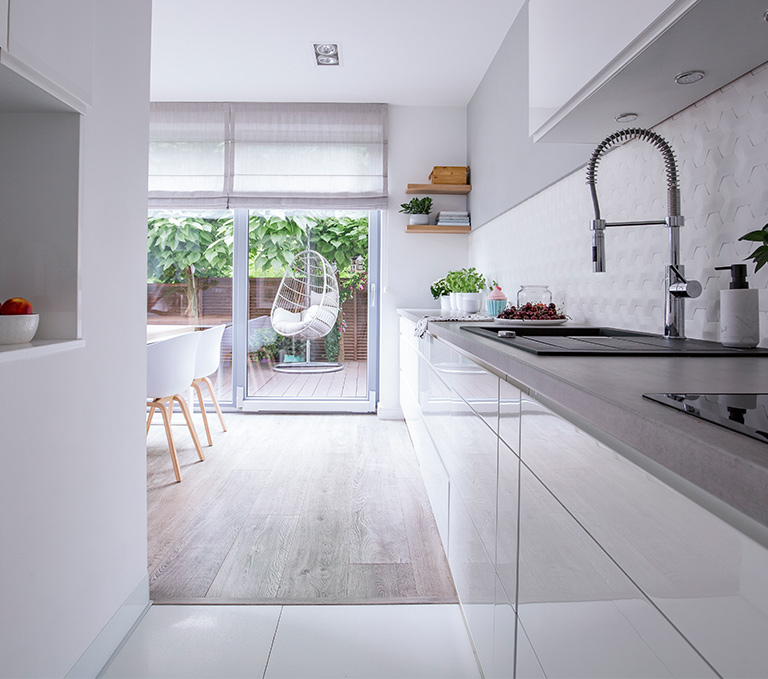 Modern kitchen looking into garden